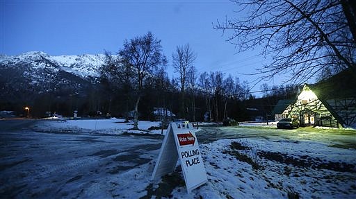 A sign directs motorists to the Valley Bible Chalet polling location in Indian, Alaska, south of Anchorage, in this November 2014 file photo.