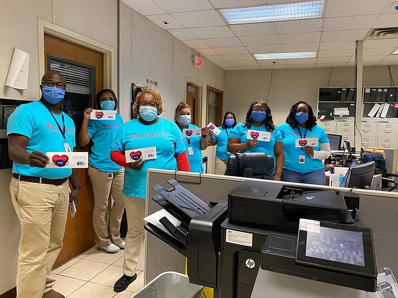 Employees of Tyson Foods gather to plan how to raise money for the United Way at their plant. 
(Special to The Commercial)