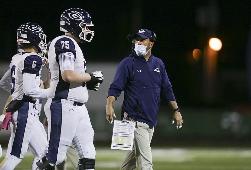 Chris Young (right) is in his first year as Greenwood’s head coach, but the Bulldogs have reached the
state championship game for the fifth time in six years.
(NWA Democrat-Gazette/Charlie Kaijo)
