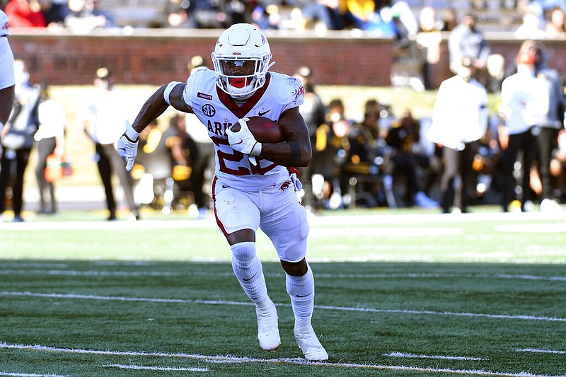 Arkansas running back Trelon Smith scores on a touchdown run during the second half of an NCAA college football game against Missouri Saturday, Dec. 5, 2020, in Columbia, Mo.