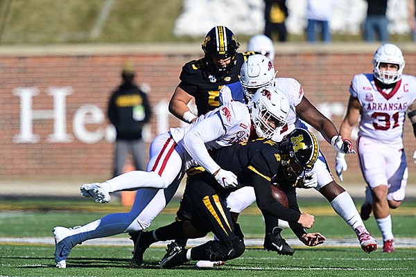 Arkansas defensive end Julius Coates sacks Missouri quarterback Connor Bazelak during a game Saturday, Dec. 5, 2020, in Columbia, Mo. 