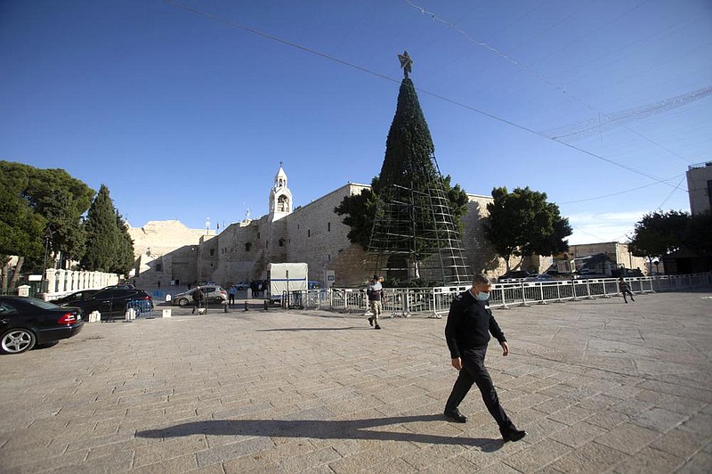 A man walks outside Bethlehem’s Church of the Nativity. The town usually packed with pilgrims from around the world in the weeks before Christmas remains largely quiet during the coronavirus pandemic.
(AP/Majdi Mohammed)