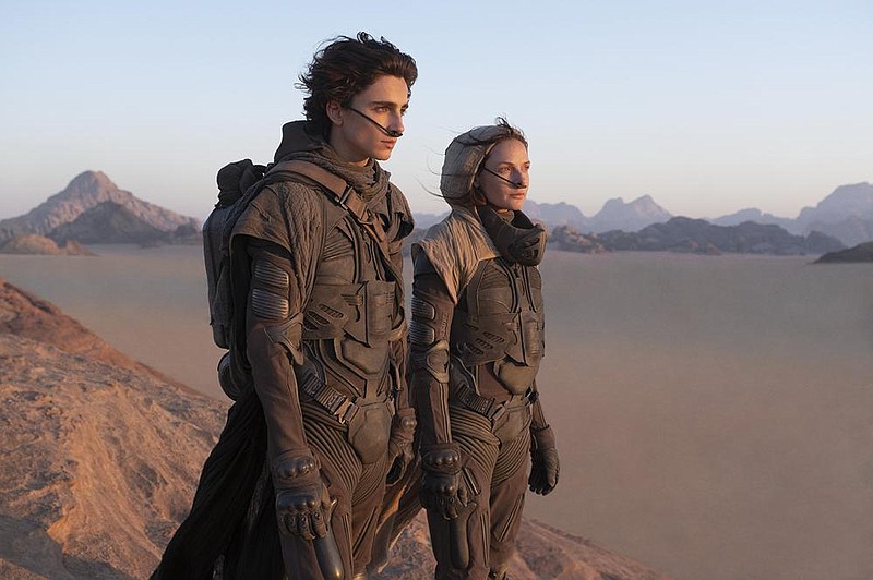 Timothee Chalamet and Rebecca Ferguson are shown in a scene from the forthcoming film “Dune.” Warner Bros. Pictures on Thursday announced that all of its 2021 film lineup will stream on HBO Max at the same time the movies play in theaters.
(AP/Warner Bros. Entertainment/Chia Bella James)