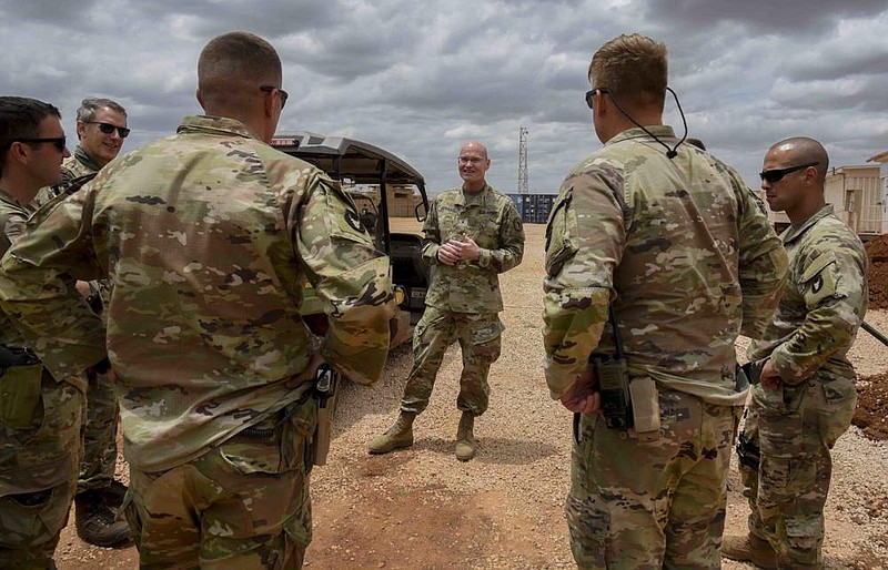 U.S. Army Brig. Gen. Damian Donahoe (center), deputy commanding general for a Horn of Africa task force, talks with service members in September in Somalia.
(AP/Kristin Savage)
