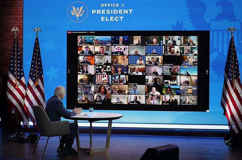 President-elect Joe Biden, sitting Friday in The Queen Theater in Wilmington, Del., participates in a virtual meeting about jobs with the National Association of Counties Board of Directors.
(AP/Andrew Harnik)