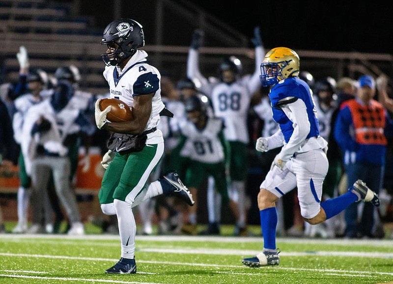 Corey Platt (left) runs 59 yards to score a touchdown Friday in Little Rock Christian’s 52-28 victory over Harrison in the Class 5A semifinals at F.S. Garrison Stadium in Harrison. Platt, a Tulane commitment, scored six touchdowns to lead the Warriors to their third consecutive trip to the state championship game.
(Special to the NWA Democrat-Gazette/David Beach)