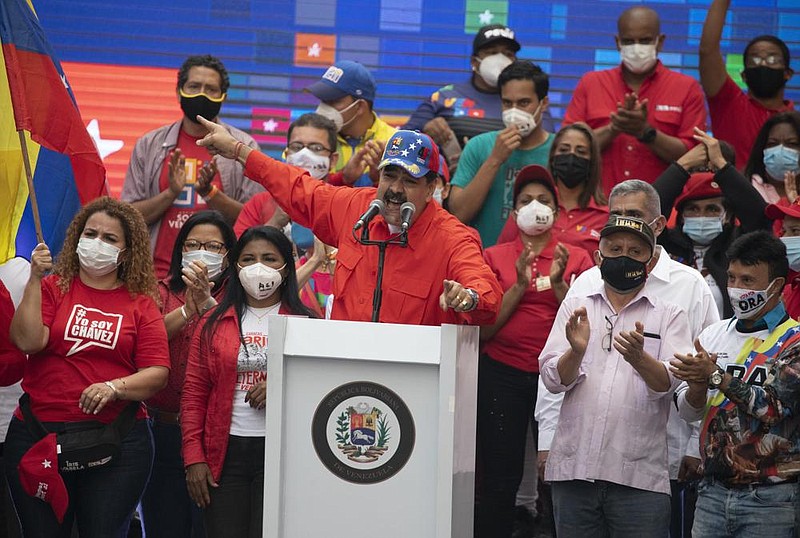 Venezuelan President Nicolas Maduro speaks to supporters Thursday in Caracas during a closing campaign rally for National Assembly elections. Venezuelans go to the polls Sunday.
(AP/Ariana Cubillos)