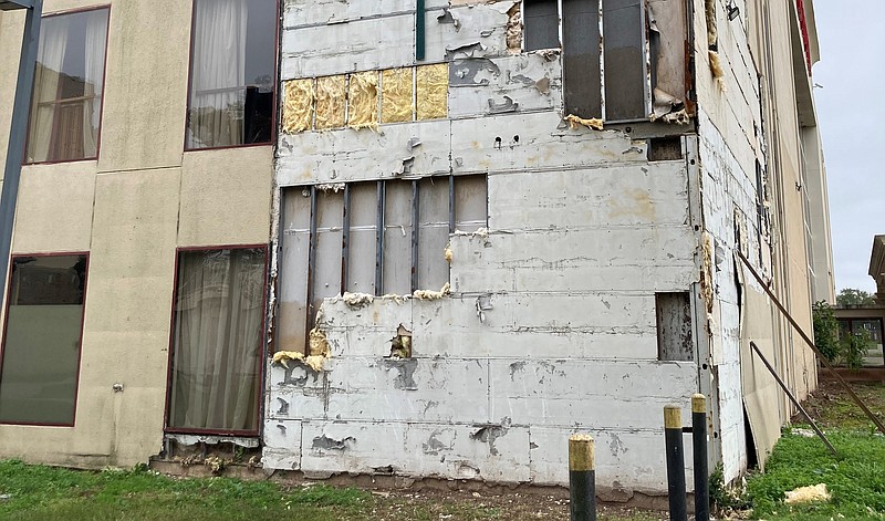 Recently, a large section of the facade on the northwest corner of the Plaza Hotel separated from the building, exposing insulation, support members, and even opening a hole into a corner room on the third floor. (Pine Bluff Commercial/Byron Tate)