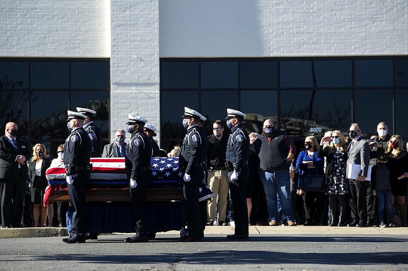 Officers stand at attention during the playing of taps at the funeral of Sgt. J.L. ' Buck' Dancy, 62, at New Life Church in North Little Rock on Tuesday, Dec. 8, 2020. See more photos at arkansasonline.com/129funeral/

(Arkansas Democrat-Gazette/Stephen Swofford)