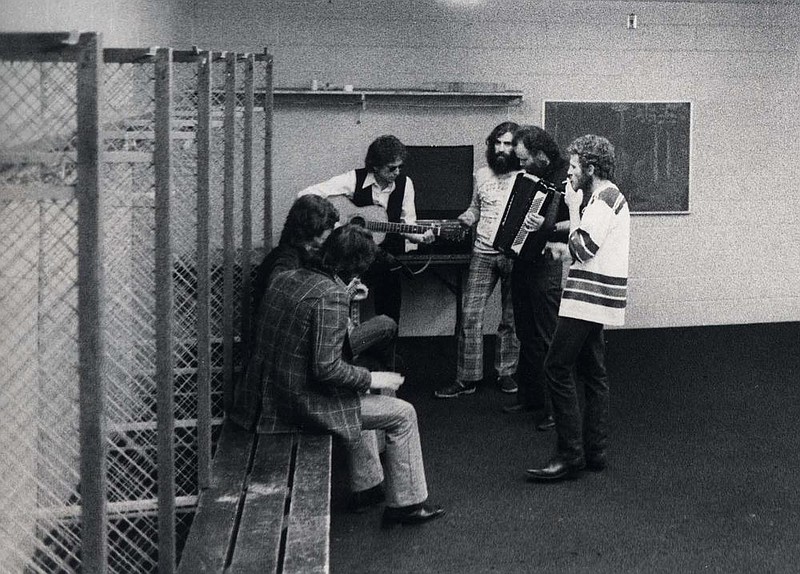 The Band, clockwise from lower left: Rick Danko, Robbie Robertson, Bob Dylan (with guitar),  Richard Manuel, Garth Hudson and Levon Helm

CORRECTION: An earlier version of this caption misspelled Rick Danko's name.