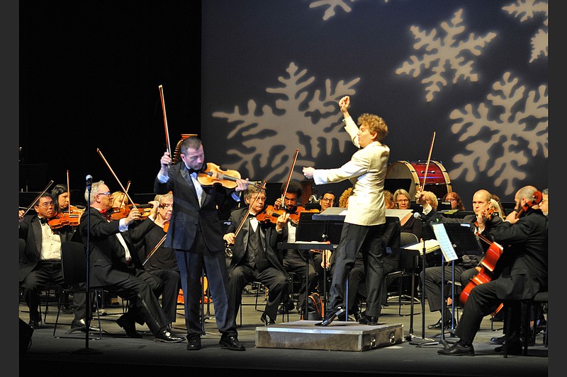 Co-concertmaster Kiril Laskarov soloed with the Arkansas Symphony and former conductor Philip Mann in the orchestra's 2016 "Home for the Holidays" concerts. (Democrat-Gazette file photo)