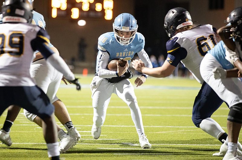 Pulaski Academy quarterbacks Nolen Bruffert (shown, middle) and Charlie Fiser have flourished for the Bruins this season, even though Coach Kevin Kelley said he originally wanted to pick a starter after three games. “I didn’t have the summer to evaluate them. After three games, both of them were doing some good things and doing some things we needed to work on. I couldn’t pick. They both answered the bell every time we needed them to do it,” Kelley said.
(Arkansas Democrat-Gazette/Justin Cunningham)