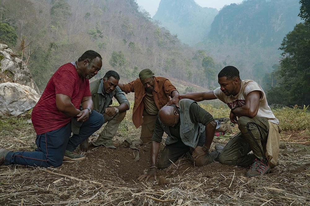 Isiah Whitlock Jr. (from left), Norm Lewis, Clarke Peters, Delroy Lindo and Jonathan Majors perform in a scene from the Spike Lee film “Da 5 Bloods.” In a year when Black Lives Matter forced a rethinking of so many things, the film looks at the Vietnam War from the oft-ignored perspective of its Black soldiers. (David Lee/Netflix via AP)