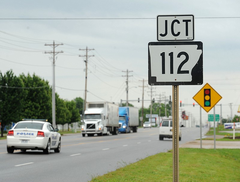 Traffic flows Friday, May 29, 2015, along Henri de Tonti Boulevard in Tontitown near the intersection with Arkansas 112.