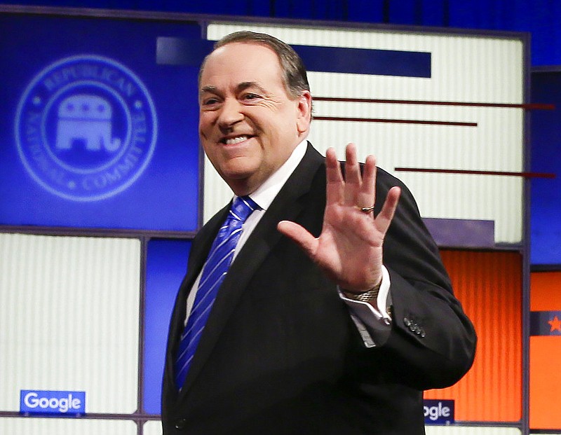 Former Arkansas Gov. Mike Huckabee walks onto the stage before a Republican presidential primary debate in Des Moines, Iowa, in this Jan. 28, 2016, file photo.