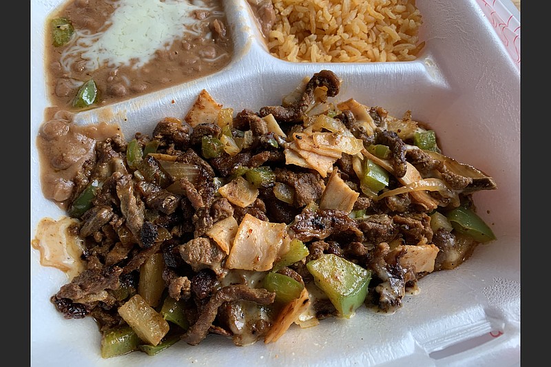 Taqueria el Palenque's Plato Alembre mixes steak, marinated pork, ham, pineapple, bell peppers and onions.
(Arkansas Democrat-Gazette/Eric E. Harrison) story.lead_photo.caption