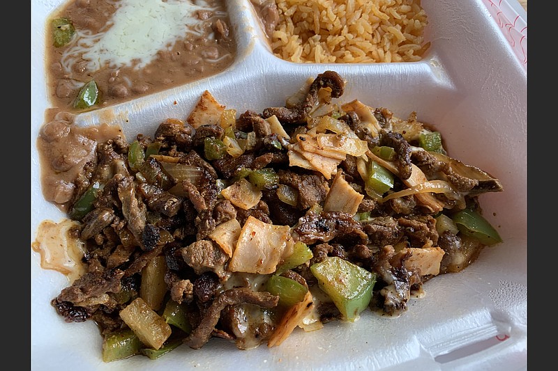 Taqueria el Palenque's Plato Alembre mixes steak, marinated pork, ham, pineapple, bell peppers and onions. 
(Arkansas Democrat-Gazette/Eric E. Harrison)