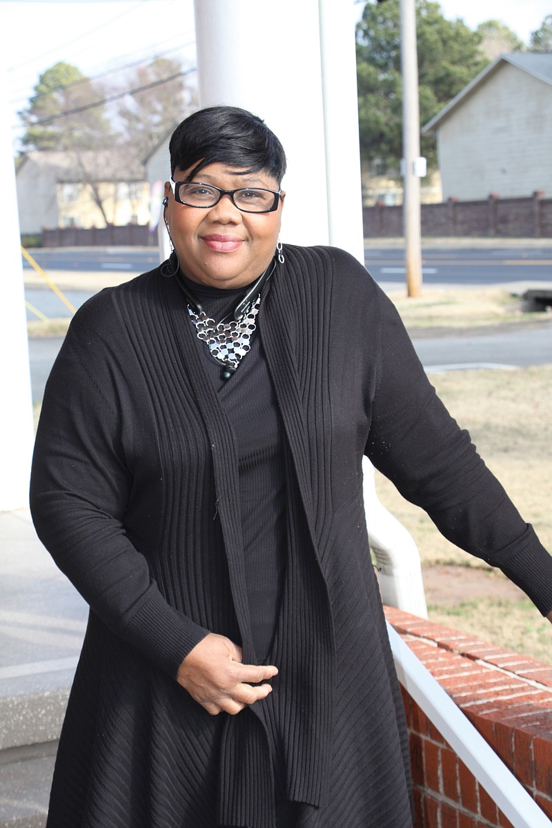 Ewonda Baker of North Little Rock stands outside St. Mark Community Church in Jacksonville, where her husband is the pastor. In November, Baker was recognized by Gov. Asa Hutchinson for quarantining with two foster children in Searcy after they had tested positive for COVID-19. 