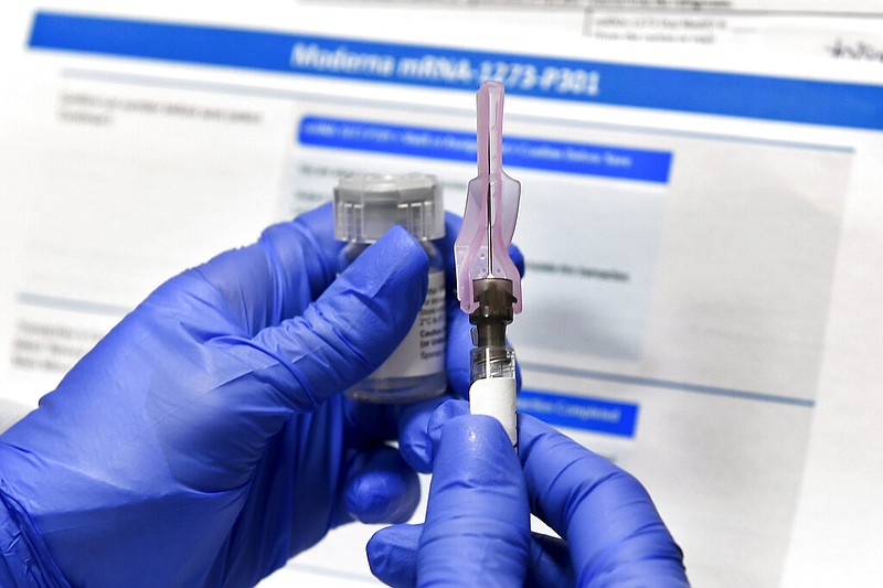 A nurse prepares a shot during a study of a possible covid-19 vaccine developed by the National Institutes of Health and Moderna Inc. in Binghamton, N.Y., in this July 27, 2020, file photo. (AP/Hans Pennink)

