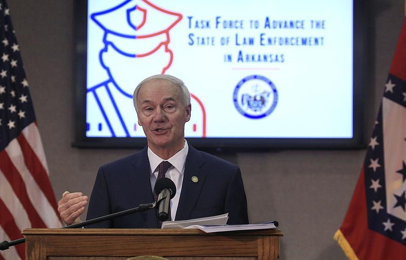 Gov. Asa Hutchinson speaks Thursday in Little Rock about the final report from the Task Force to Advance the State of Law Enforcement in Arkansas. More photos at arkansasonline.com/1218law/.
(Arkansas Democrat-Gazette/Staton Breidenthal)