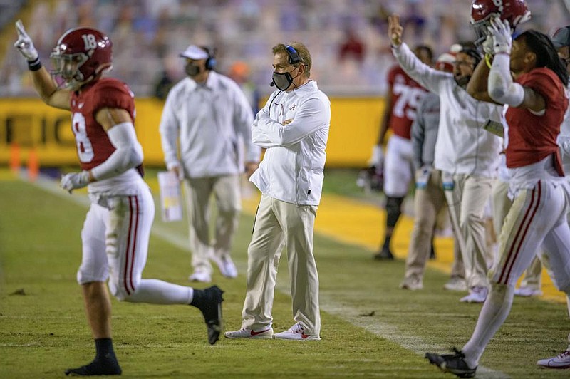 Coach Nick Saban (center) and the top-ranked Alabama Crimson Tide won every game this season by an average margin of victory of 32.7 points.
(AP/Matthew Hinton)