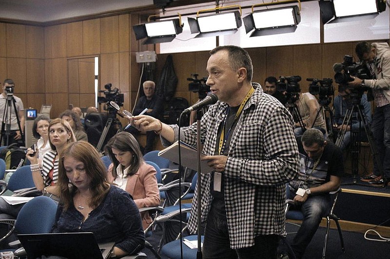 Romanian sports reporter and investigative journalist Catalin Tolontan gestures in this scene from Alexander Nanau’s extraordinary documentary “Collective.” story.lead_photo.caption