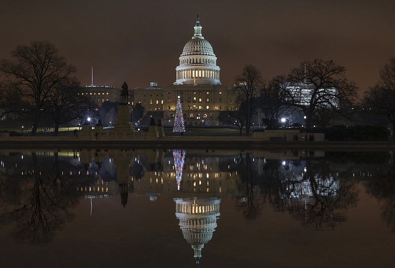 The Capitol is mirrored in the Reflecting Pool in Washington in this Dec. 28, 2018, file photo.
