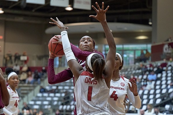 Arkansas guard Marquesha Davis (1) contests a shot during a game against Arkansas-Little Rock on Dec. 19, 2020, at the Jack Stephens Center in Little Rock.