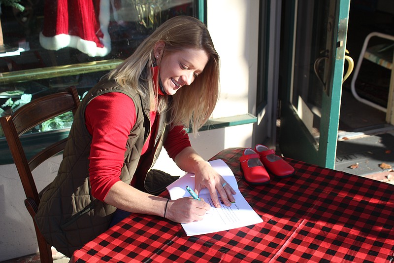 Randa Stevens held a book signing at Jefferson Street Books last Saturday to mark the release of her new book, Lilly and the Red Shoes. (Matt Hutcheson/News-Times)