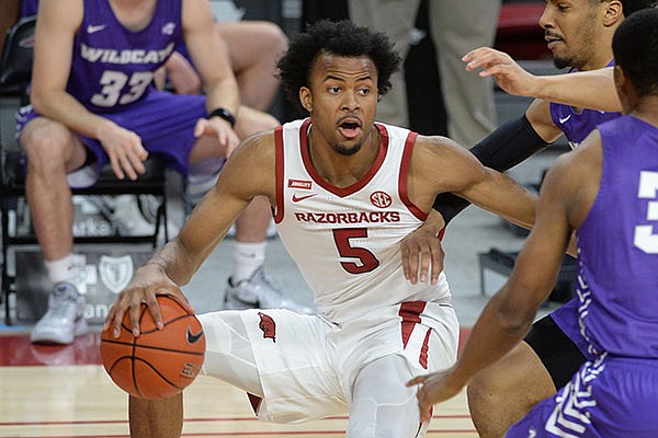Arkansas guard Moses Moody is double teamed during a game against Abilene Christian on Tuesday, Dec. 22, 2020, in Fayetteville.