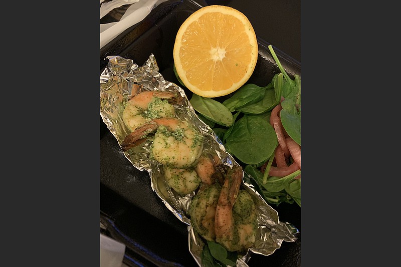 Shrimp Chimichurri from Cannibal and Craft came with a side salad of pickled onion and baby spinach salad plus half an orange. (Arkansas Democrat-Gazette/Eric E. Harrison)