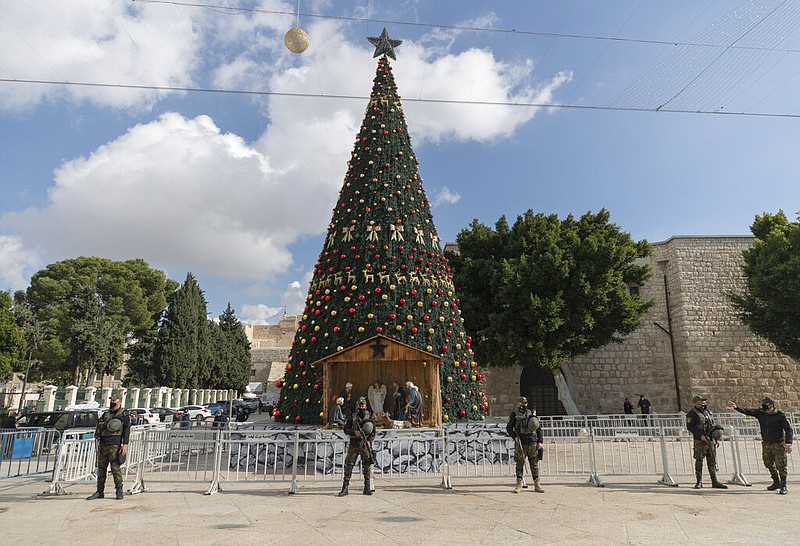 A Palestinian National security unit is deployed in Manger Square, adjacent to the Church of the Nativity, traditionally believed by Christians to be the birthplace of Jesus Christ, ahead of Christmas, in the West Bank city of Bethlehem, Wednesday, Dec. 23, 2020.