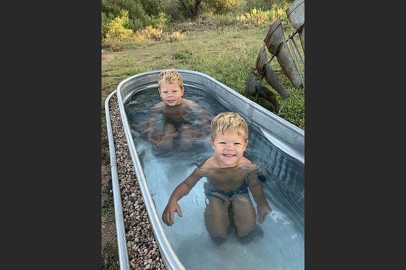 Sara Haddox's sons Caleb (back) and David (front) enjoying the hot trough for the first time. The family rents out their vacation home on airbnb.com. (Courtesy @houseonthellano/Sara Haddox)