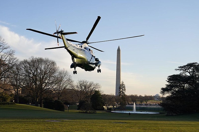 President Donald Trump leaves the White House on Wednesday aboard Marine One as he and first lady Melania Trump begin their journey to a holiday stay in Florida.
(AP/Evan Vucci)