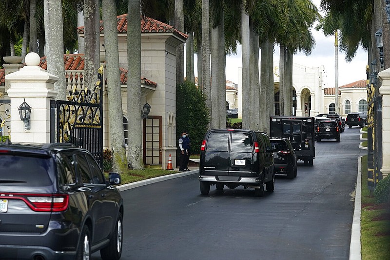 President Donald Trump's motorcade arrives at Trump International Golf Club, Thursday, Dec. 24, 2020, in West Palm Beach, Fla.