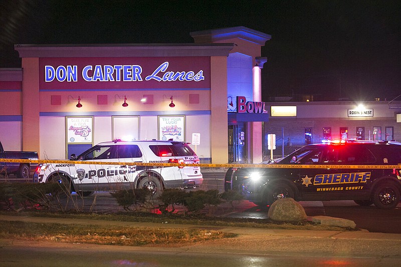 Rockford, Ill., police and other law enforcement agencies investigate the scene of a shooting at a bowling alley Saturday, Dec. 26, 2020, in Rockford.