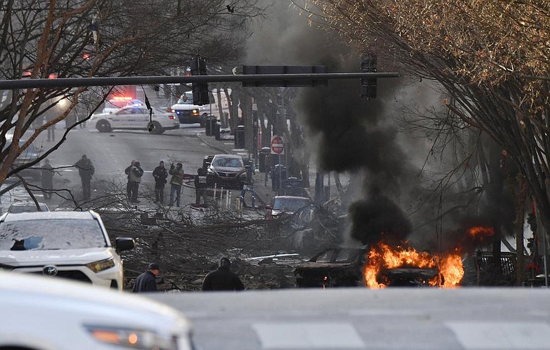 Flames consume a vehicle Friday after the downtown Nashville explosion. Witnesses described hearing a boom and then feeling the buildings shake.
(AP/The Tennessean/Andrew Nelles)