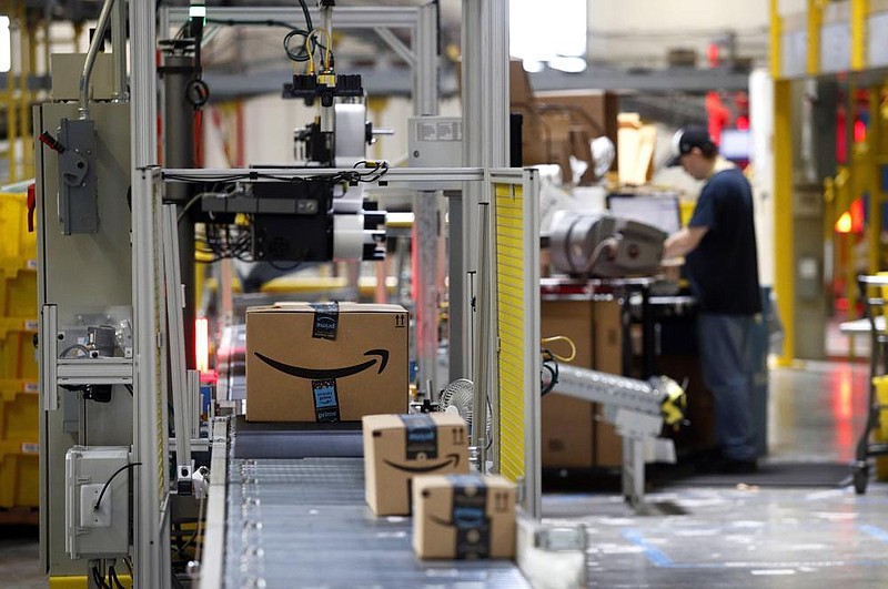 Packages pass through a scanner at an Amazon fulfillment center in Baltimore in this file photo.
(AP)
