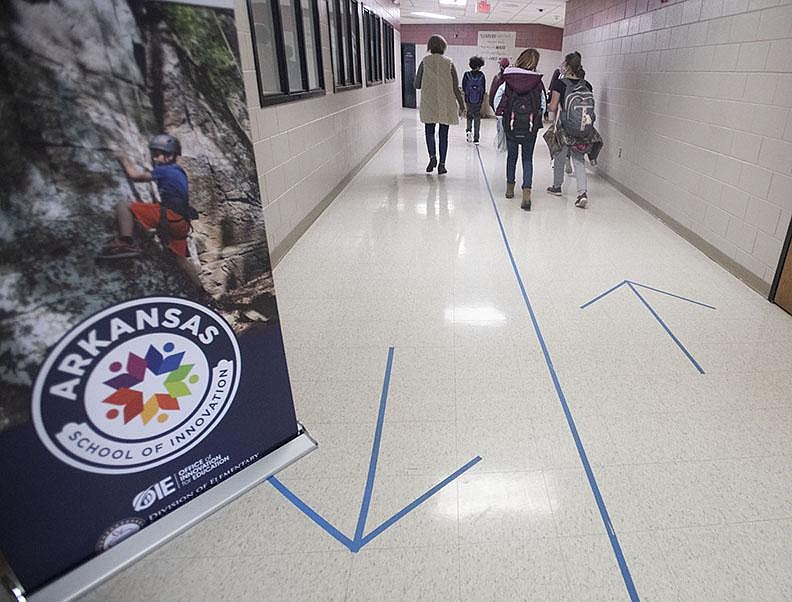 Markers direct student traffic at Lincoln Middle School earlier this month. Superintendent Mary Ann Spears says spotty internet service makes it hard for parents to avoid sending their children to in-person school.
(NWA Democrat-Gazette/J.T. Wampler)