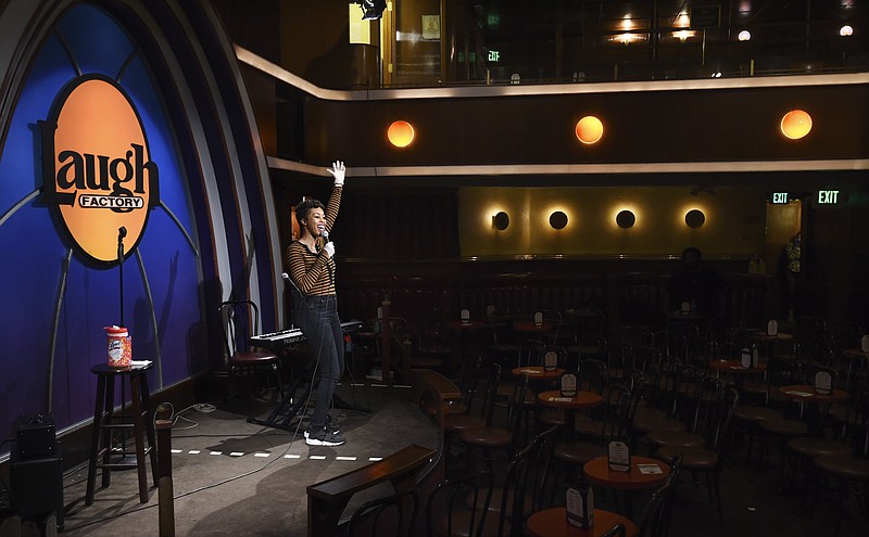 Comedian Daphnique Springs performs to an empty room during a “Laughter Is Healing” stand-up comedy livestream at the Laugh Factory comedy club April 20 in Los Angeles. (AP Photo/Chris Pizzello)