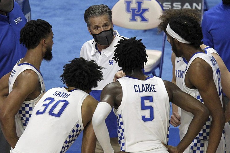 Kentucky Coach John Calipari (center) instructs his team during a timeout against Notre Dame on Dec. 12. The Wildcats open SEC play Saturday at Mississippi State at 1-6, their worst start since the 1926-27 season when they finished 3-13. (AP/James Crisp)