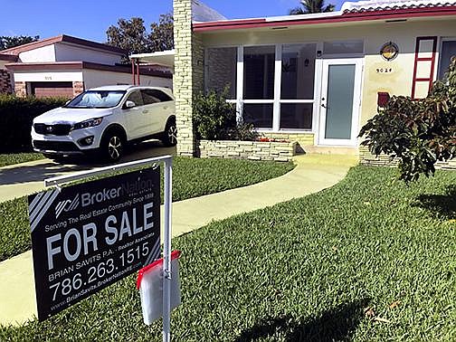 FILE - In this Feb. 21, 2020 file photo, a home is shown for sale in Surfside, Fla. 