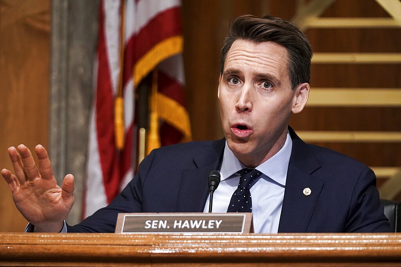 FILE - In this Dec. 16, 2020 file photo, Sen. Josh Hawley, R-Mo., asks questions during a Senate Homeland Security & Governmental Affairs Committee hearing to discuss election security and the 2020 election process on Capitol Hill in Washington. Walmart apologized on Wednesday, Dec. 30, for a tweet that called Hawley a sore loser for contesting the U.S. presidential election. The tweet from Walmart was in response to Hawley’s tweet announcing his plans to raise objections next week when Congress meets to affirm President-elect Joe Biden’s victory in the election. (Greg Nash/Pool via AP, File)