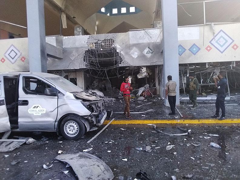 A building at the airport in Yemen’s southern city of Aden shows damage Wednesday where two explosions rocked the airport shortly after a plane carrying the newly formed Cabinet landed.
(AP/Majid Saleh)