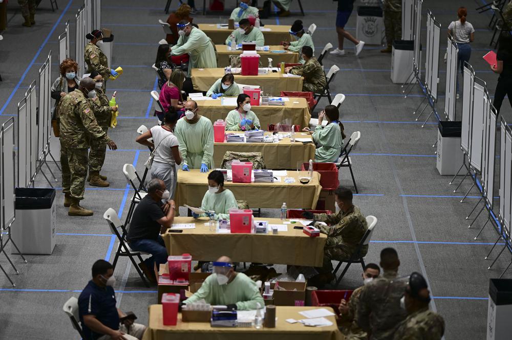 Stations are set up Wednesday for health workers to get vaccinated for covid-19 at the Pedrin Zorrilla Coliseum in San Juan, Puerto Rico.
(AP/Carlos Giusti)