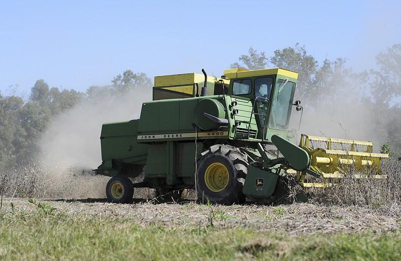 FILE — Cody Hays plows his soybean crop in Siloam Springs Thursday October 14, 2010.
