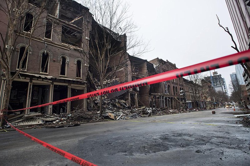 Buildings damaged in the Christmas Day explosion are taped off Thursday in downtown Nashville, Tenn. Officials are continuing to assess the damage.
(AP/The Tennessean/Andrew Nelles)