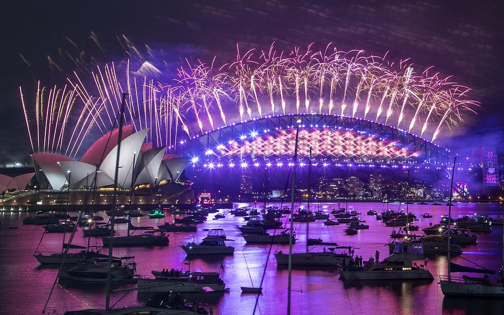 Fireworks explode over the Sydney Opera House and Harbour Bridge in celebration of the new year Thursday in Sydney, Australia.
(AP/Mark Baker)