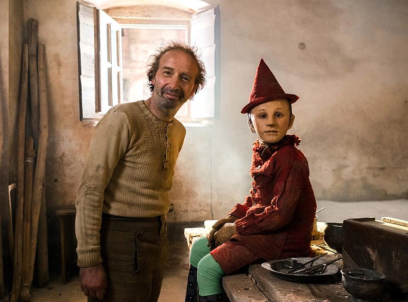 Roberto Benigni, who plays the lonely woodcarver Gepetto and 8-year-old Federico Ielapi, who plays the title character, on the set of Matteo Garrone’s “Pinocchio.”