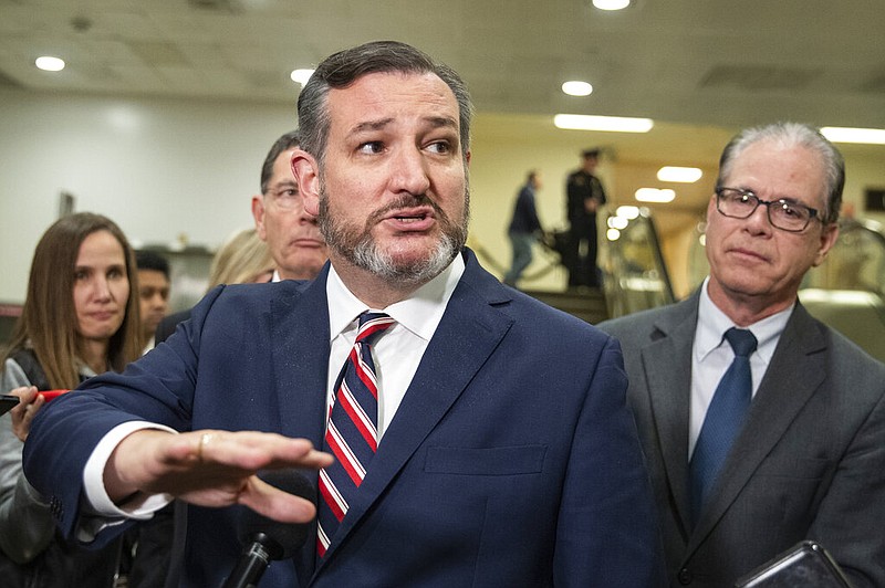 U.S. Sen. Ted Cruz, R-Texas, speaks to reporters at the Capitol in Washington in this Jan. 27, 2020, file photo as Sen. Mike Braun (right), R-Ind., looks on. Both Cruz and Braun have joined President Donald Trump’s effort to challenge the results of the 2020 presidential election.